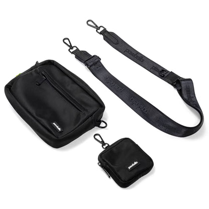 The Pawbella Crossbody Dog Walking Bag set features a black rectangular zip pouch, square clip-on pouch, and adjustable strap with metal clips—all subtly branded and inspired by Australia.
