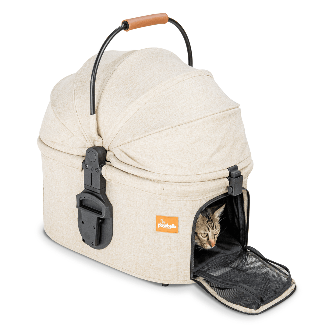 Beige Pawbella pet stroller's detachable carrier with a curious cat peeking out through the open mesh entry, featuring a comfortable handle for easy transport.