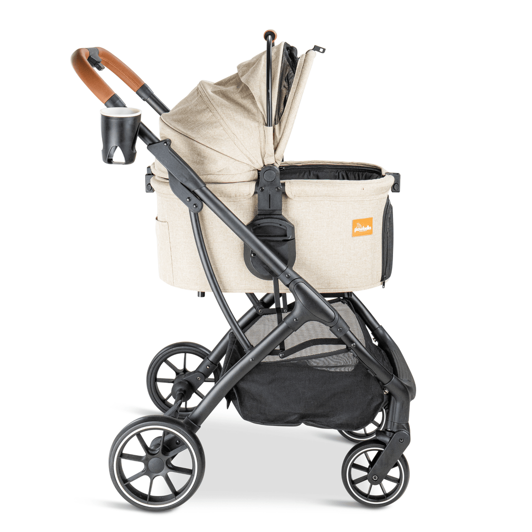 Side view of a beige Pawbella pet stroller with a half-open canopy, durable black frame, and a convenient cup holder, providing adjustable shade and comfort for pets during travel.