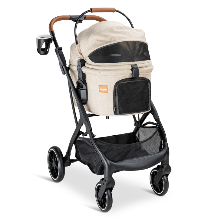 Side view of a beige Pawbella pet stroller featuring a black frame, mesh panels, and a cup holder, offering a comfortable and stylish transport option for pets.