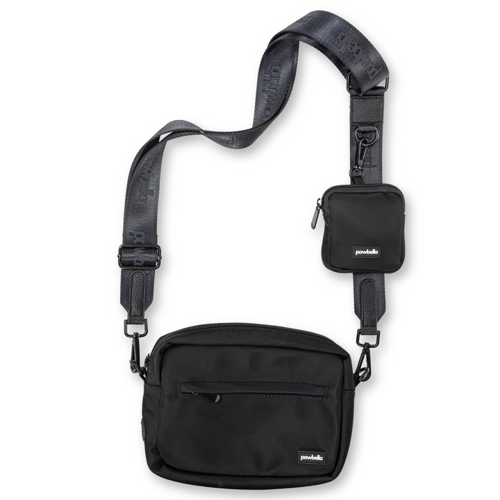 Pawbella dog walking shoulder bag in black with an adjustable strap and attached compact pouch, designed for carrying pet essentials during walks