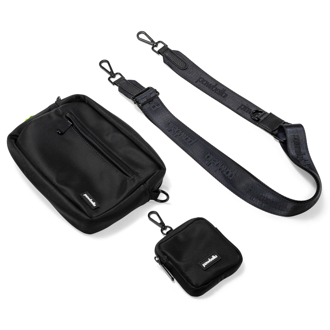 Pawbella dog walking shoulder bag set in black, featuring an adjustable strap, compact pouch, and main storage compartment for carrying pet essentials.