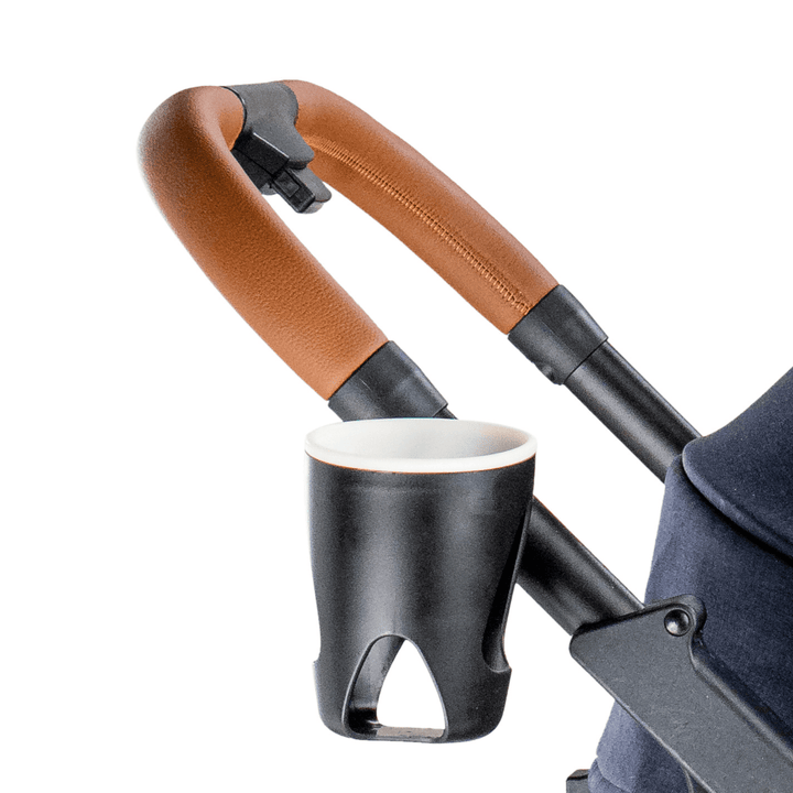 Close-up of the ergonomic handle and cup holder on the navy Pawbella pet stroller, showcasing a comfortable grip and convenient accessory for outings.