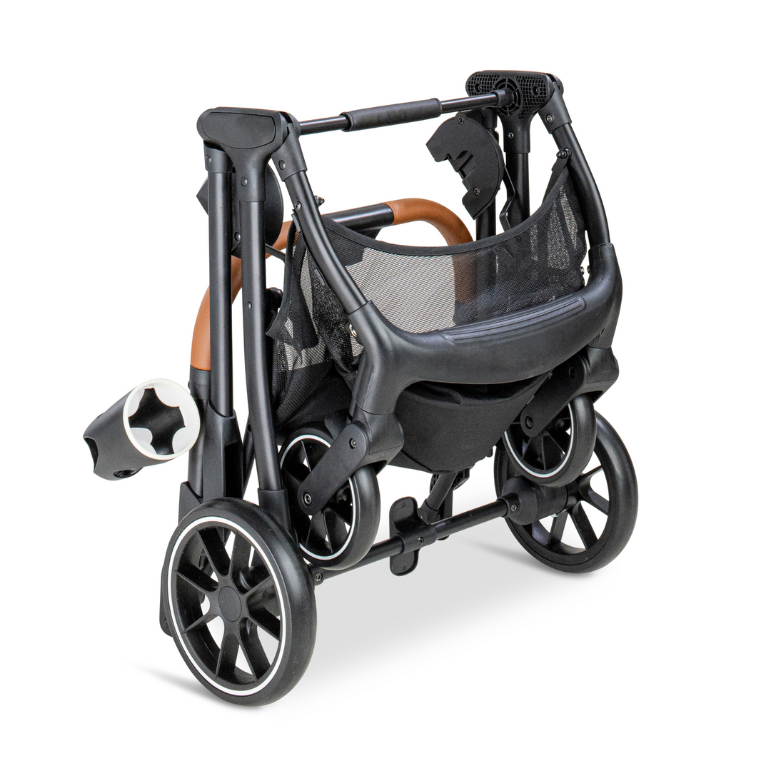 Compact, folded black frame of the Pawbella pet stroller, featuring a leather-wrapped handle and cup holder, designed for easy storage and portability.