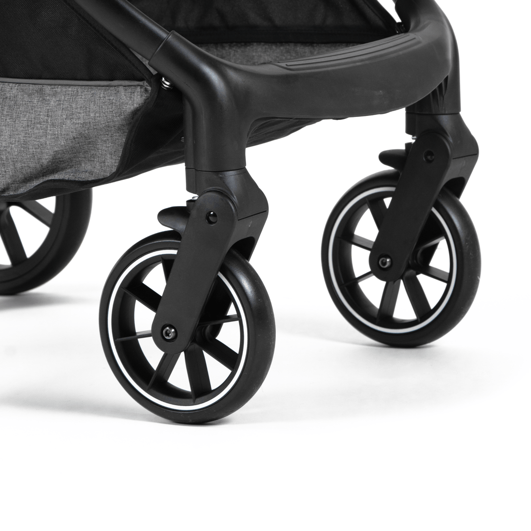 Close-up view of the lower wheel mechanism on a pet stroller, highlighting the robust black wheels and the swivel mechanism for enhanced maneuverability.